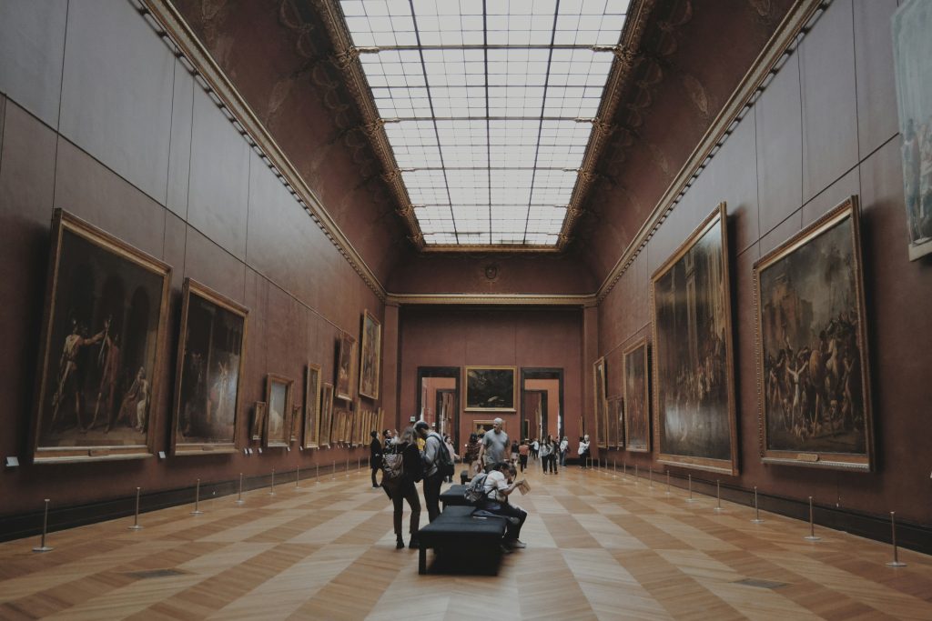 people looking on paintings