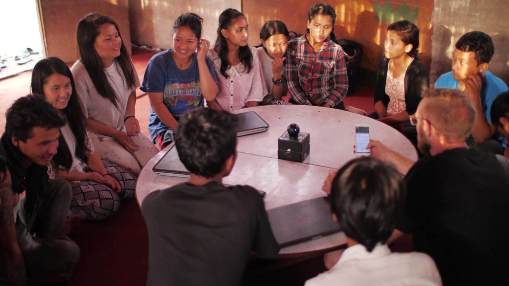 group of people talking and smiling