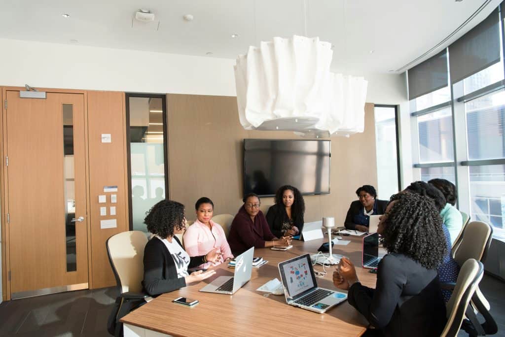 group of people sitting on the chair