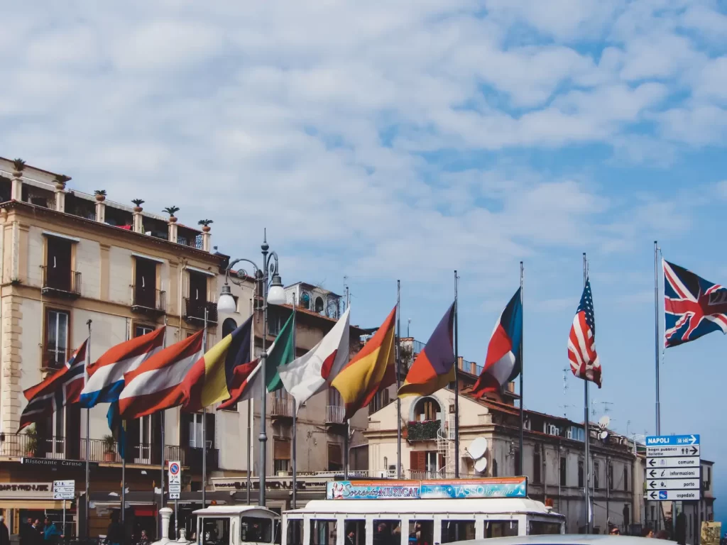 cloudy-raised-different flags-sidewalk