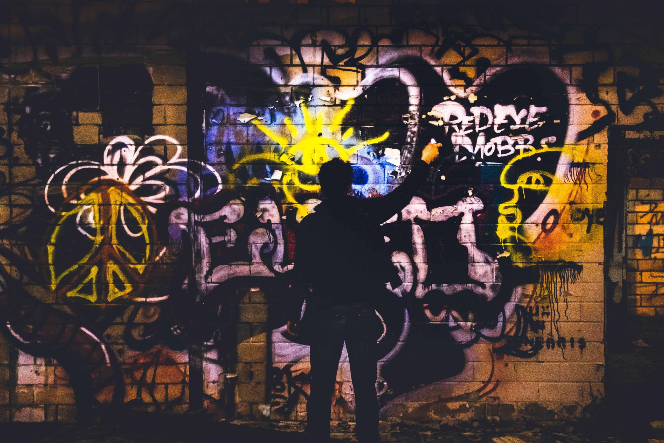 men painting art on the wall