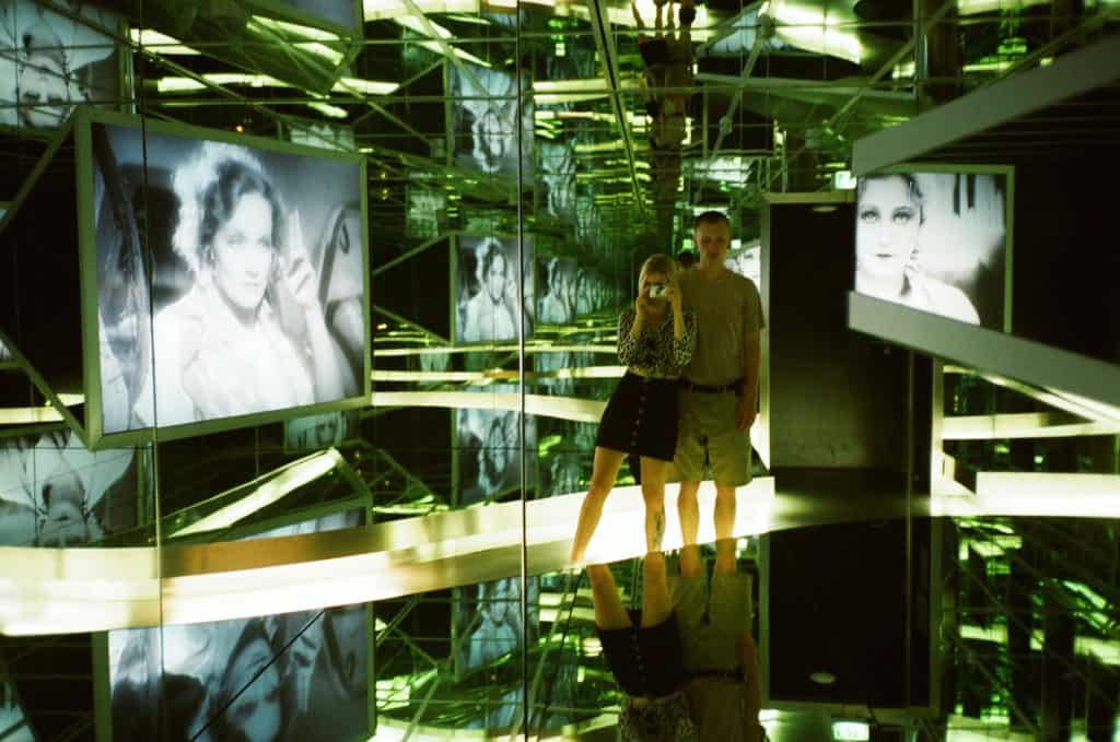 people looking on paintings