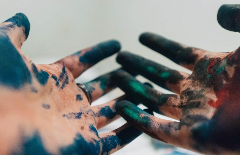 hands cover in paint
