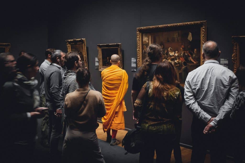 people looking on paintings