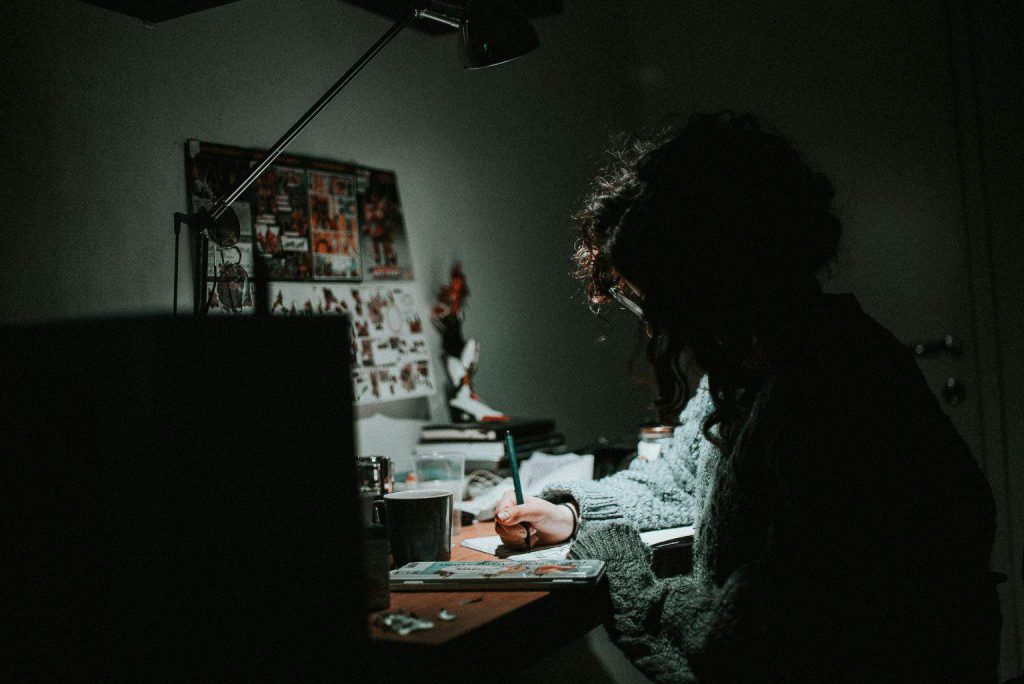 girl writing on paper