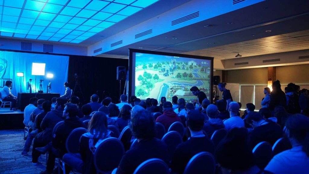 group of people watching on big screen