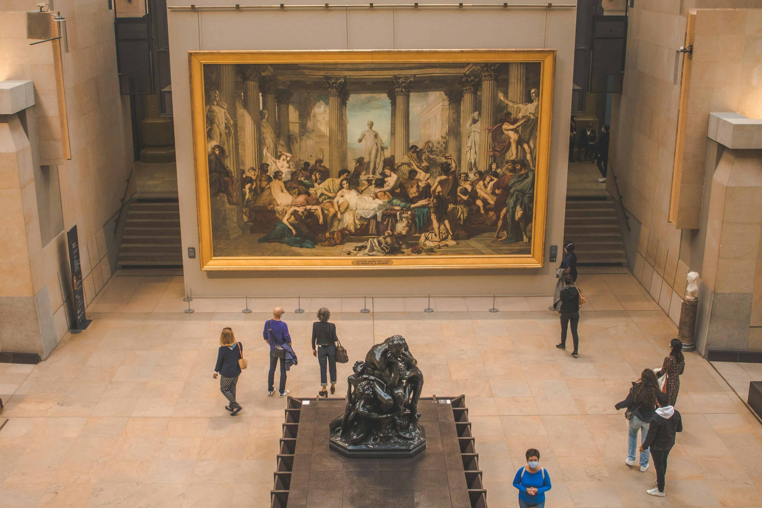 people looking at last supper painting