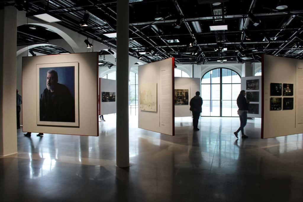 people looking on paintings