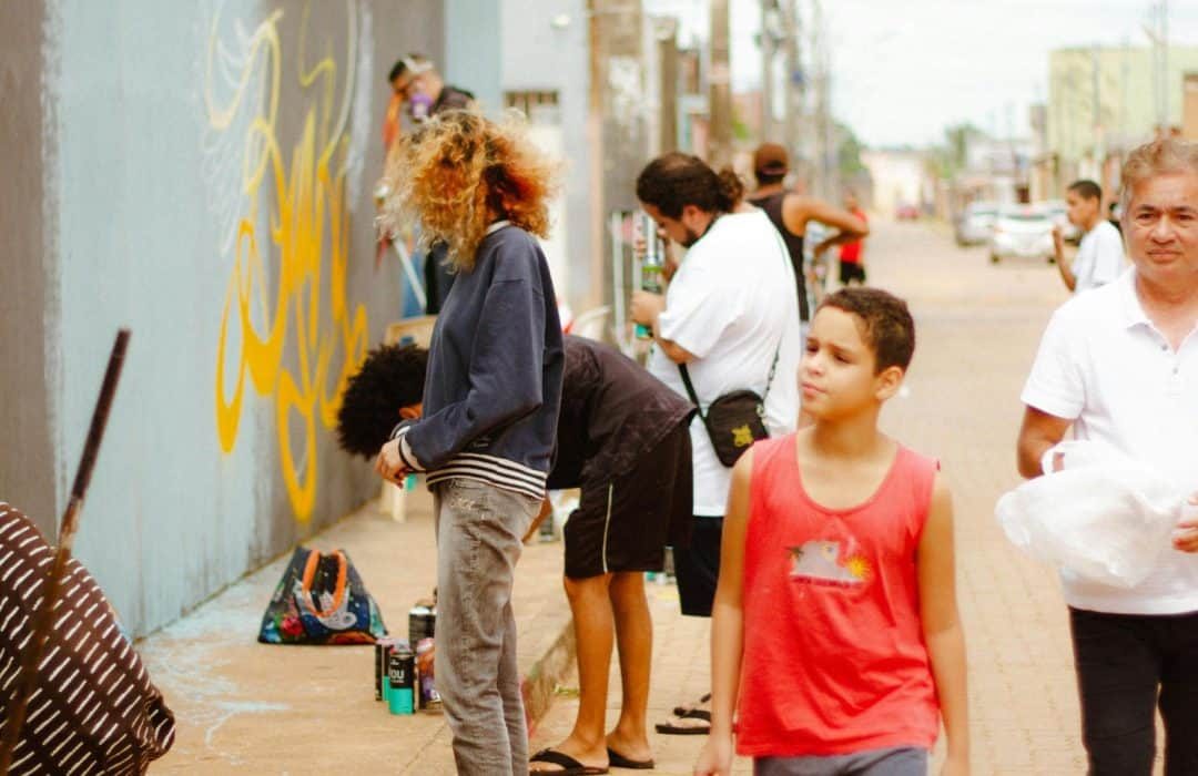 boy walking and looking to arts