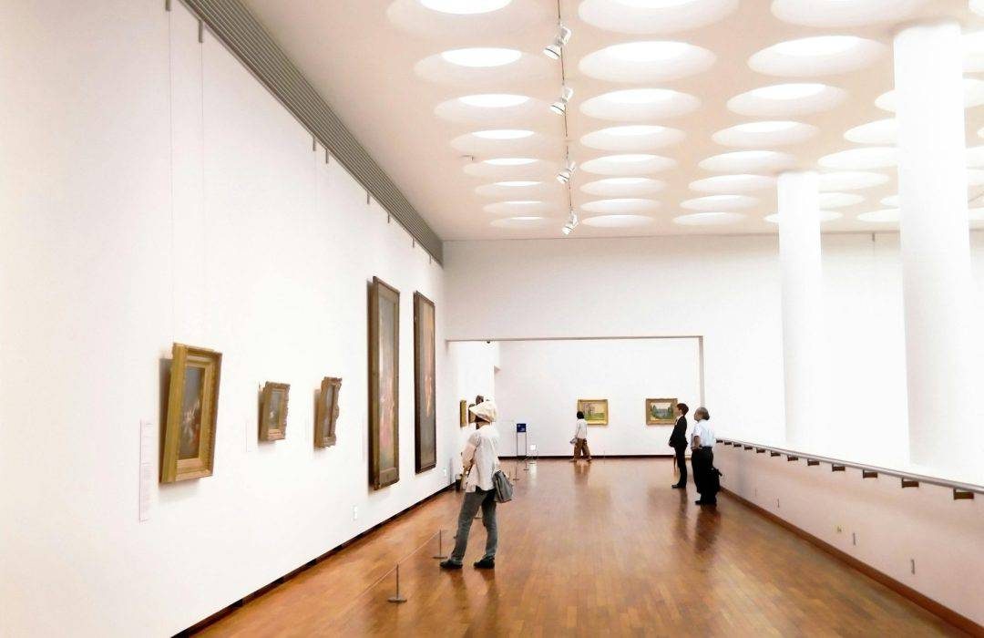white wall with arts hanging